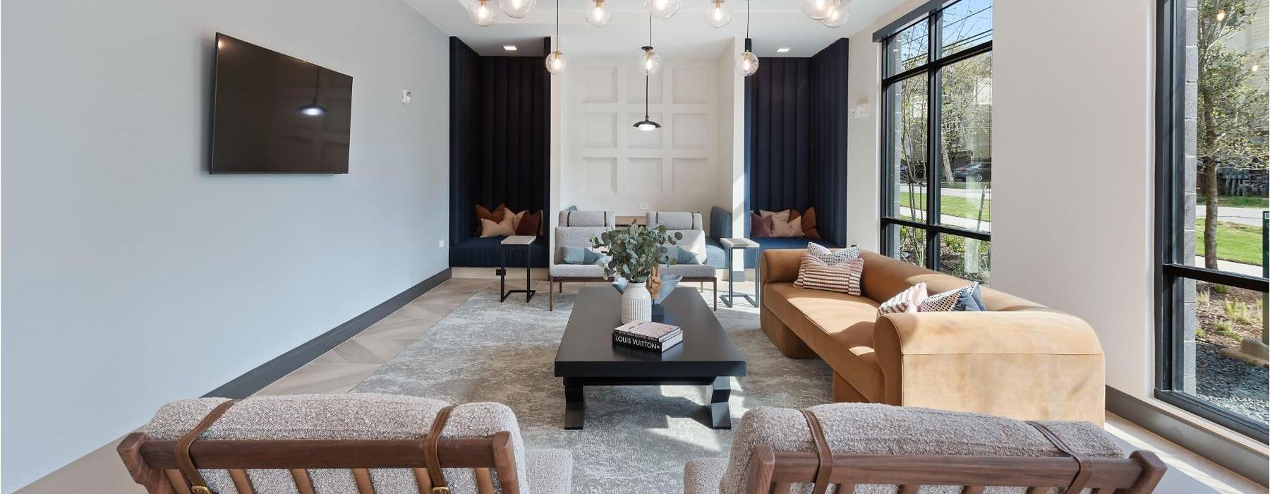 a living room with a large chandelier and a couch