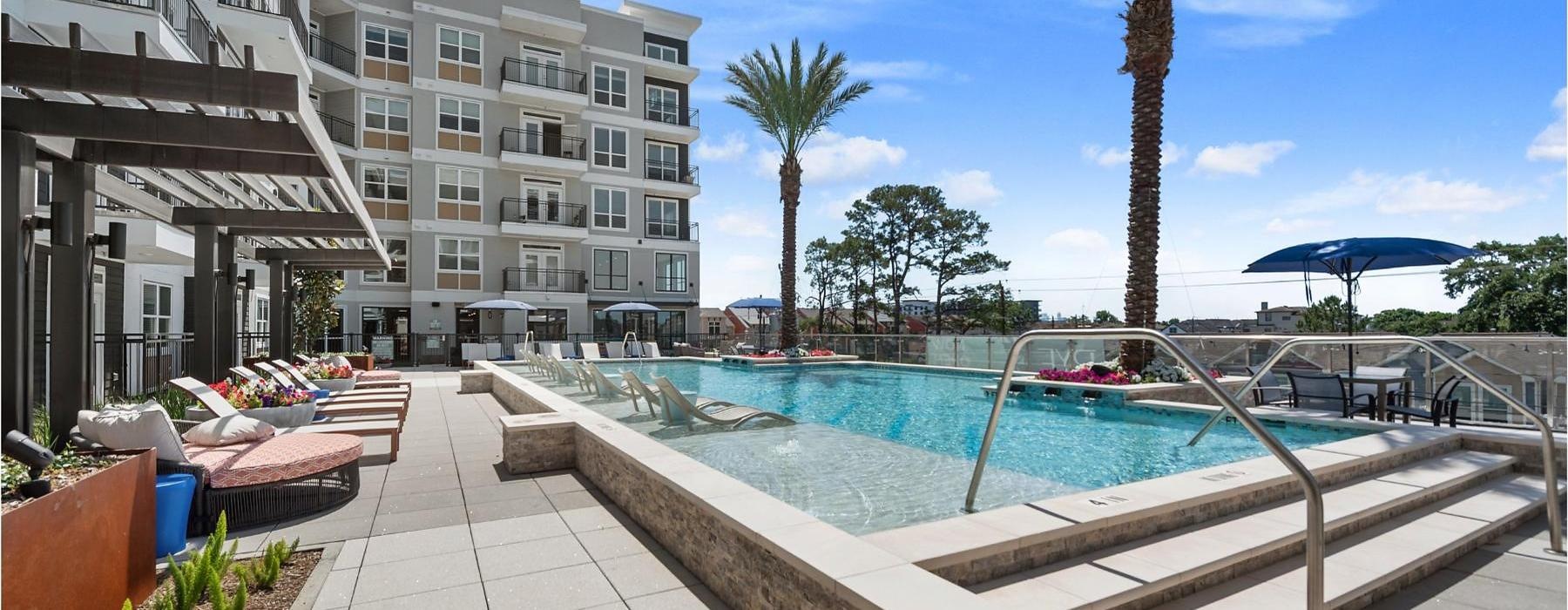 a pool in a courtyard with buildings