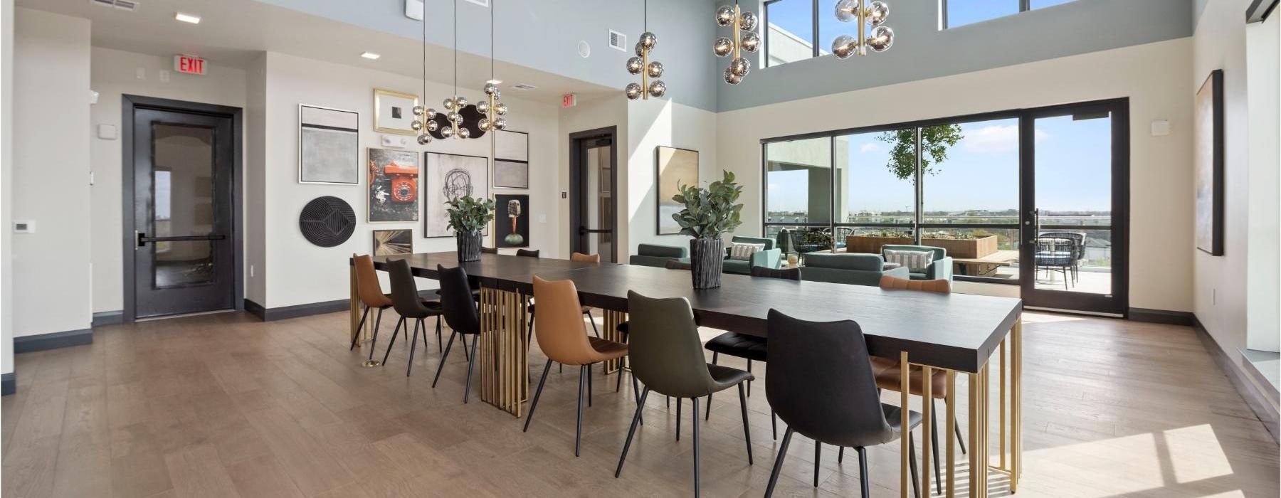 a large dining room with a large table and chairs