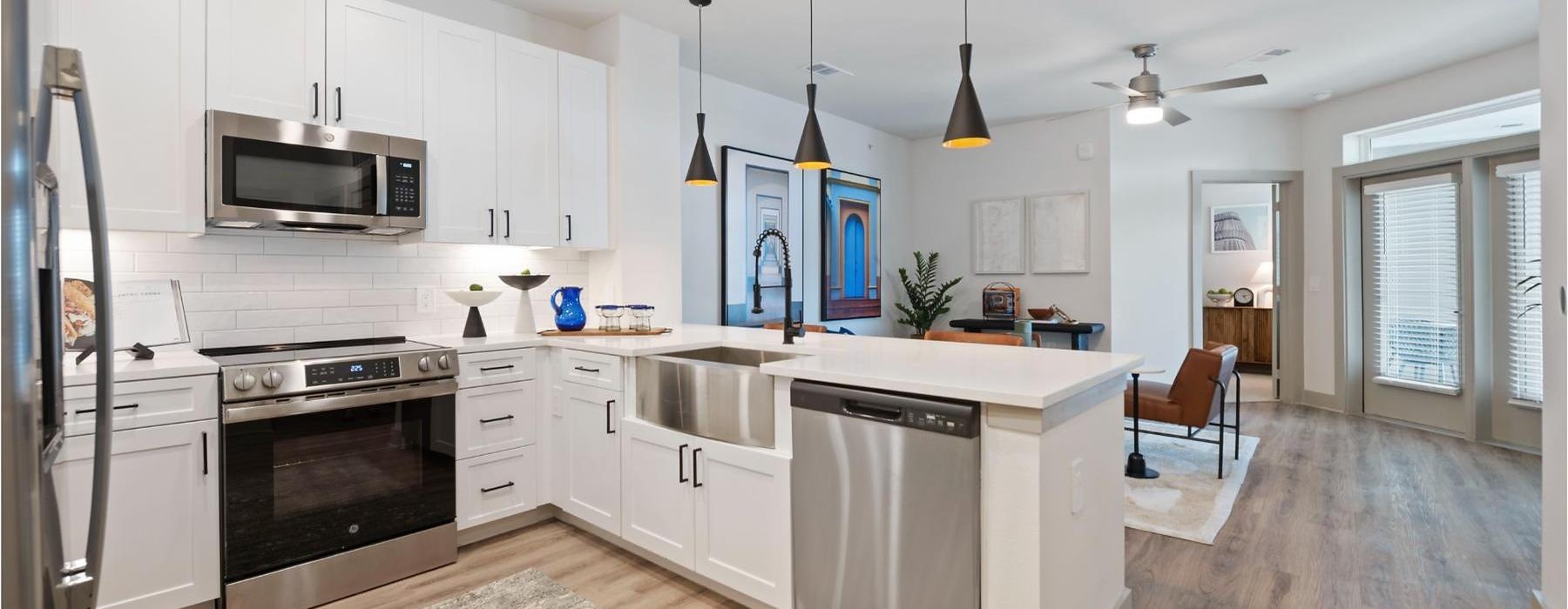 a kitchen with white cabinets